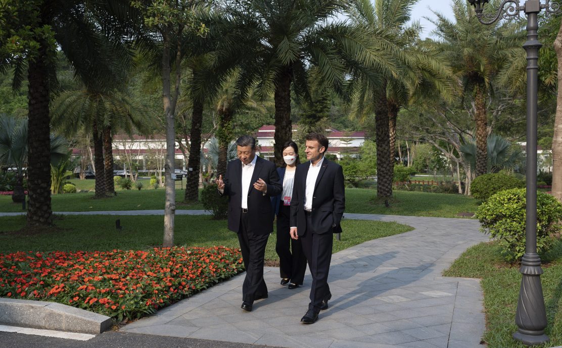 习近平专赴广州再会马克龙 漫步庭园兼品茶