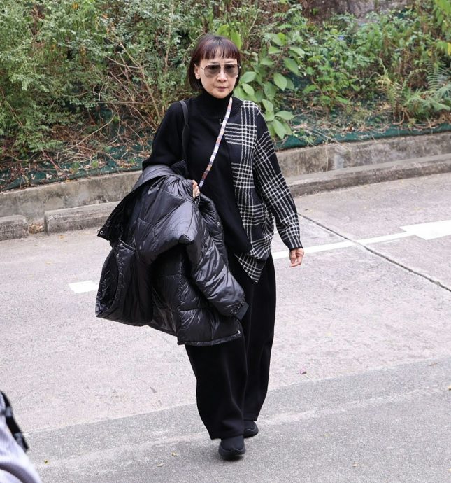 为许绍雄扶灵 罗乐林是亲妹夫