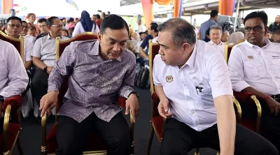 Not sitting at the same table, but sitting beside each other