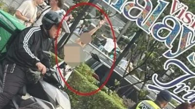 身有瘀伤 沉默站KLCC外 女子高举护照 惊动中使馆协助